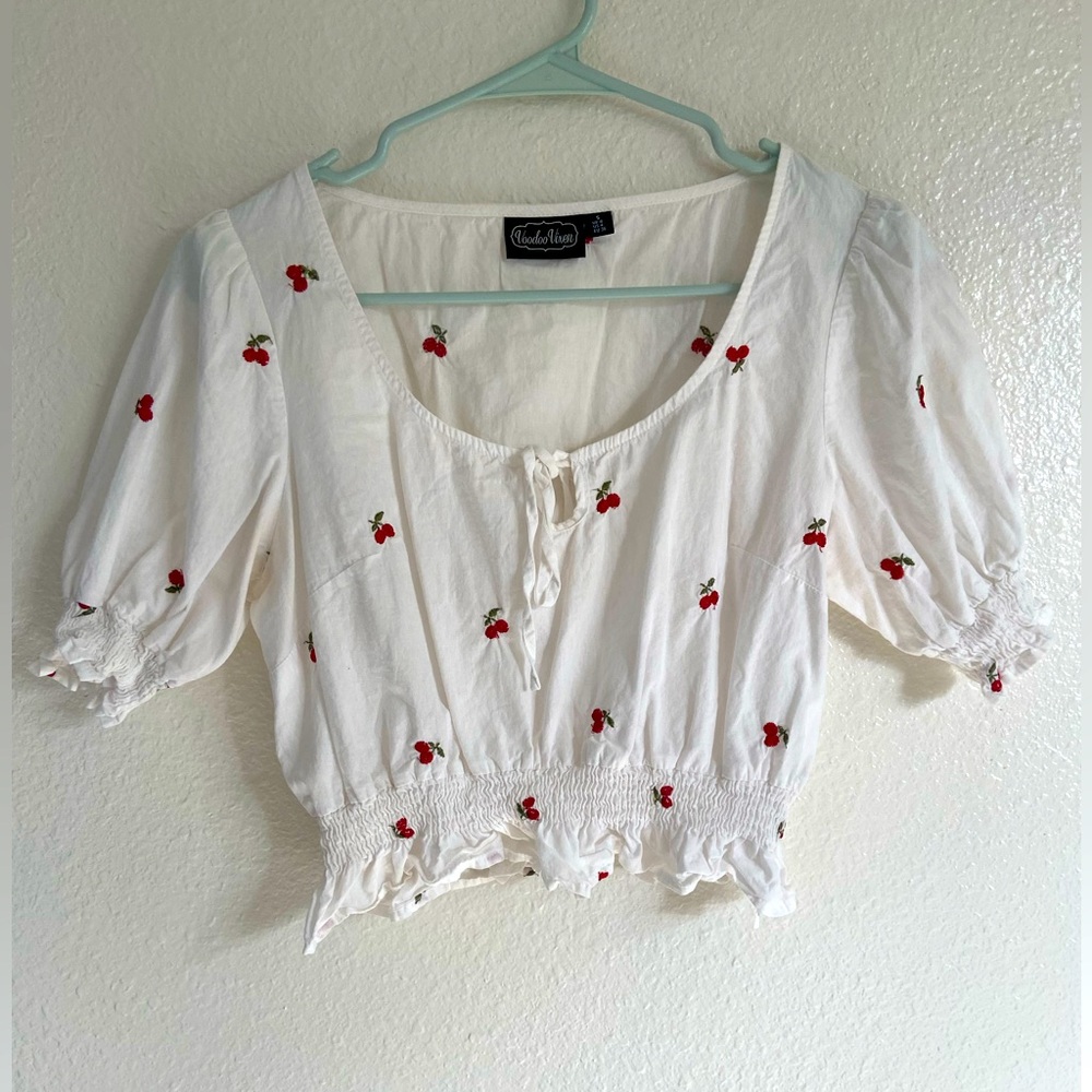 Vintage blouse with cute cherries embroidered on it . Size small in women’s